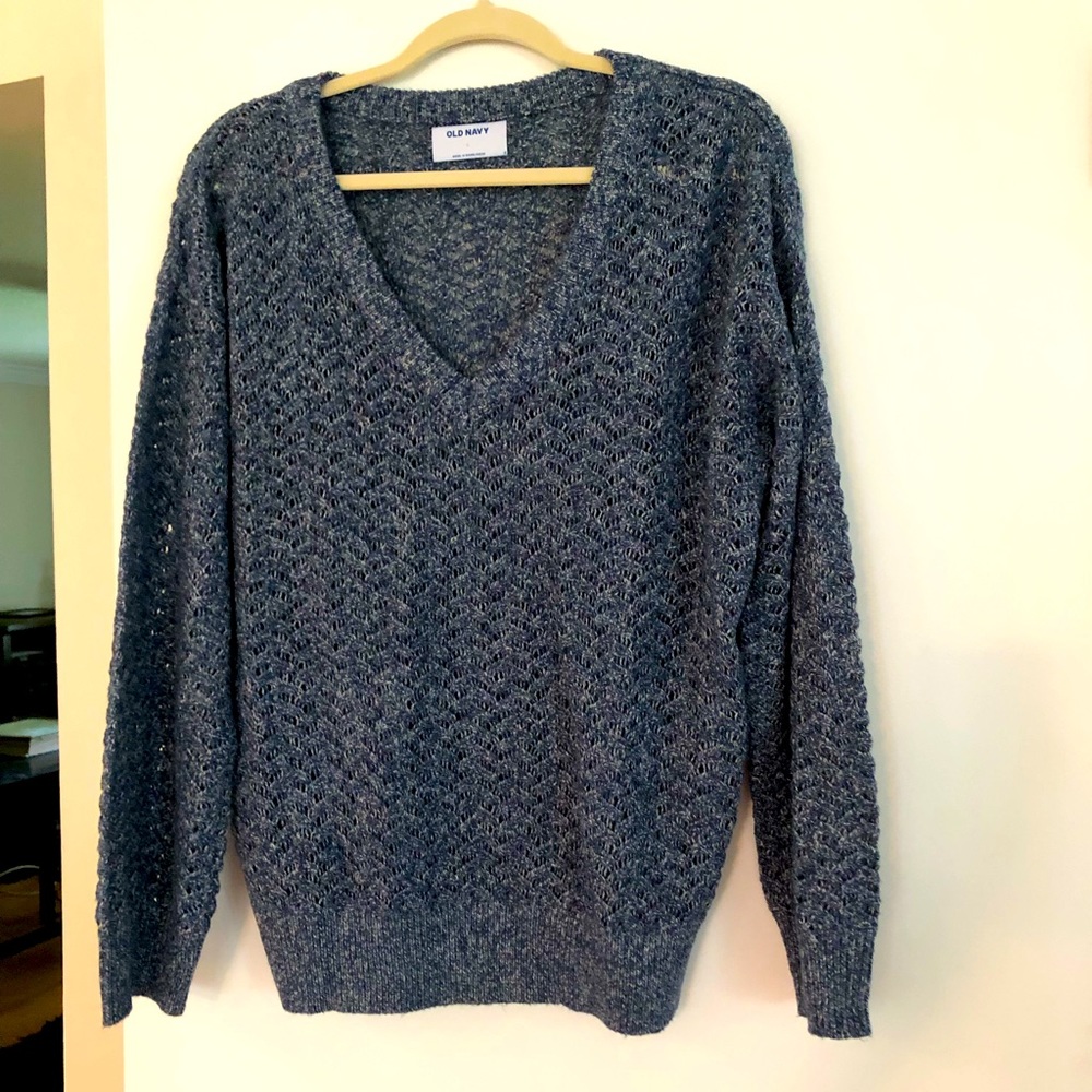 Woman’s V neck sweater.